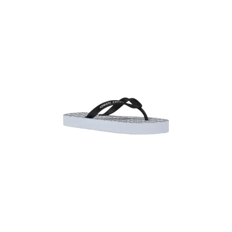 Armani Exchange women white rubber flip flops with black and white textured patterned sole shown from the back side
