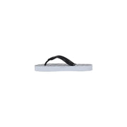 Armani Exchange women white rubber flip-flops featuring black and white grid patterned soles