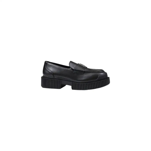 Armani Exchange women’s black leather moccasin slippers with a minimalist design and chunky ribbed sole