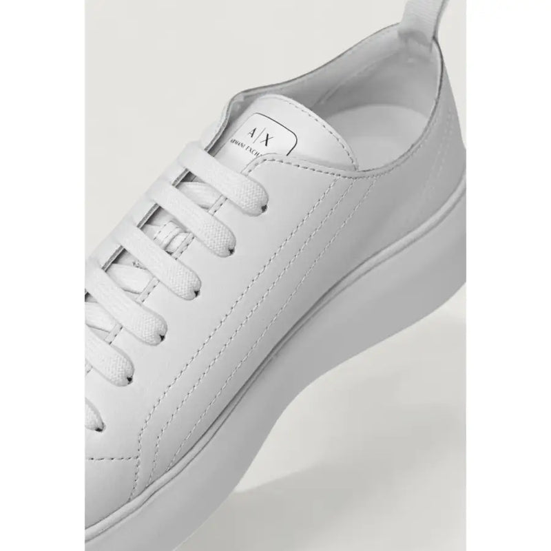 Armani Exchange women’s white leather low-top sneaker with slip-on design and minimalist style