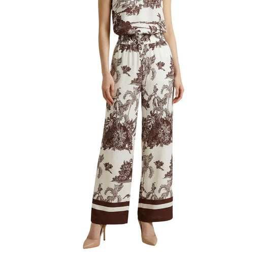 Beigefarbene Viskosehose von Artigli für Damen mit weitem Bein, braunem Pflanzenmuster und passenden gestreiften Bündchen für Frühling und Sommer