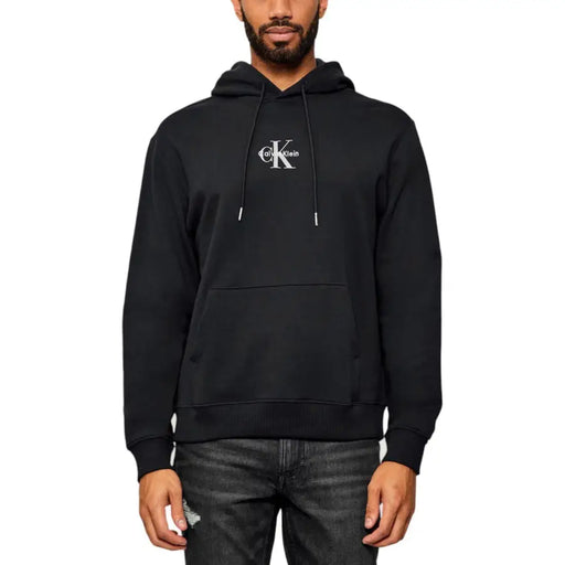 Black men’s hooded sweatshirt with white embroidered logo and front kangaroo pocket