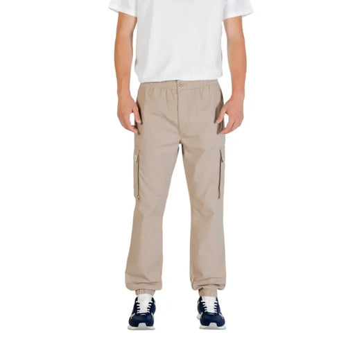 Beige cargo pants from Calvin Klein Jeans with side pockets and elastic cuffs for casual and functional wear