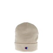 Beige Champion beanie displayed with Champion Women’s Pink Cap in 100% Polyester