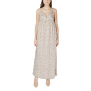 Beige patterned sleeveless maxi dress featuring flowing lace fabric with delicate spaghetti straps and a v-neckline