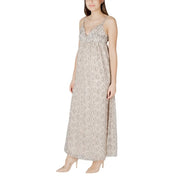 A flowing beige sleeveless maxi dress with silver snake print pattern and delicate spaghetti straps