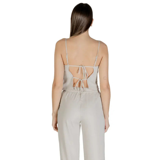 Sleek light gray satin jumpsuit with spaghetti straps and back tie