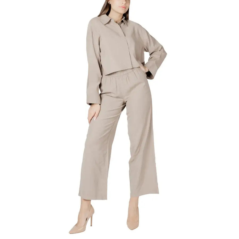 Beige linen-blend button-up shirt with relaxed fit and long sleeves for women in a viscose long sleeve round neck blouse style