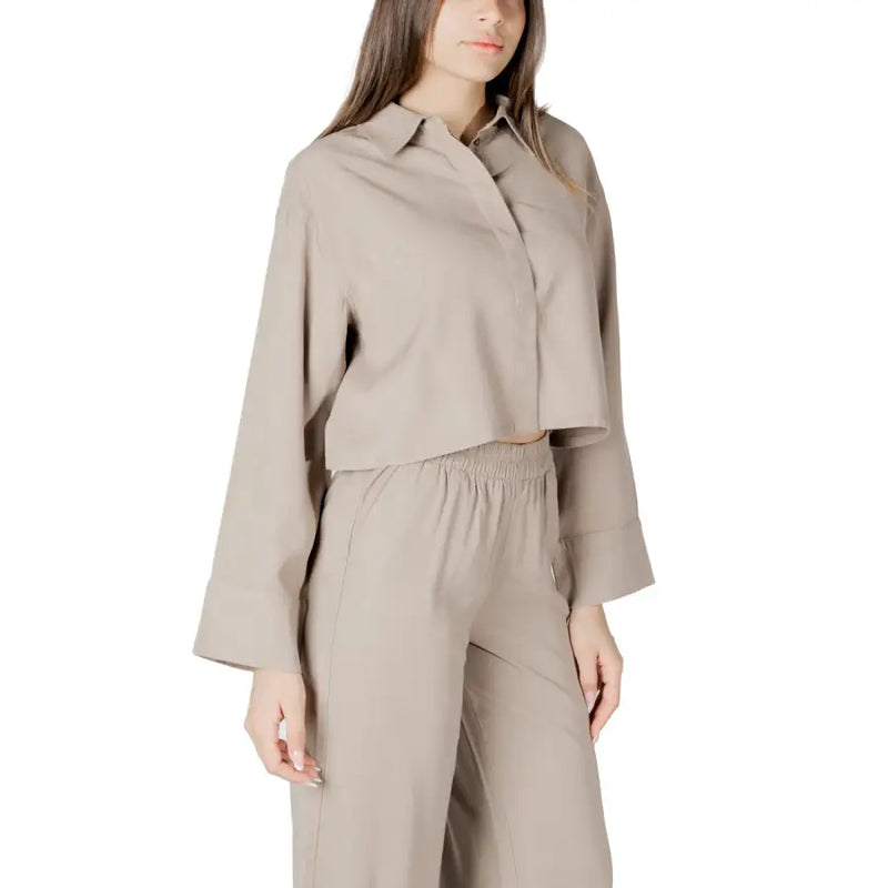 Beige viscose long sleeve round neck blouse for women with cropped button-up design and slightly flared sleeves