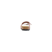 Birkenstock women pink leather slippers with buckle featuring a cork footbed and black rubber sole