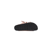 Birkenstock women pink leather slippers buckle with black rubber sole featuring a wavy tread pattern