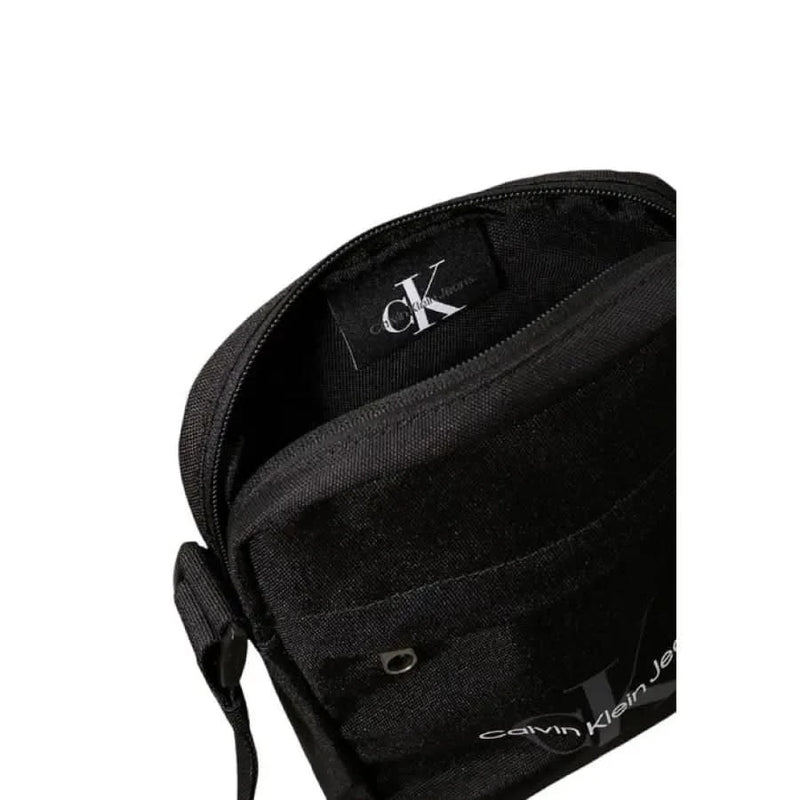 Black Calvin Klein crossbody bag with zipper closure featured in Men’s Shoulder Bag