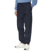 Black calvin klein sweatpants with elastic cuffs and dark navy joggers featuring a subtle white logo on the left leg