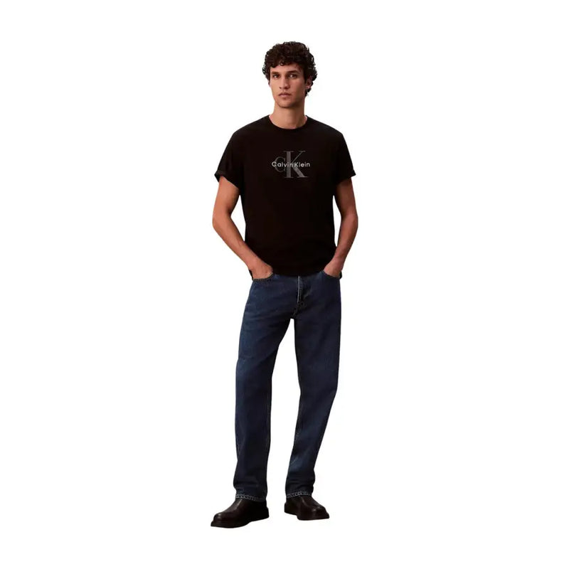 Black Calvin Klein t shirt made of soft fabric featuring a silver logo on the chest for casual wear