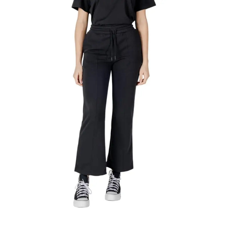 Black Cropped Flare Pants showcased in a stylish setting for contemporary fashion
