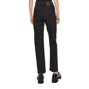 Black high waisted denim jeans for women displayed in a stylish clothing store