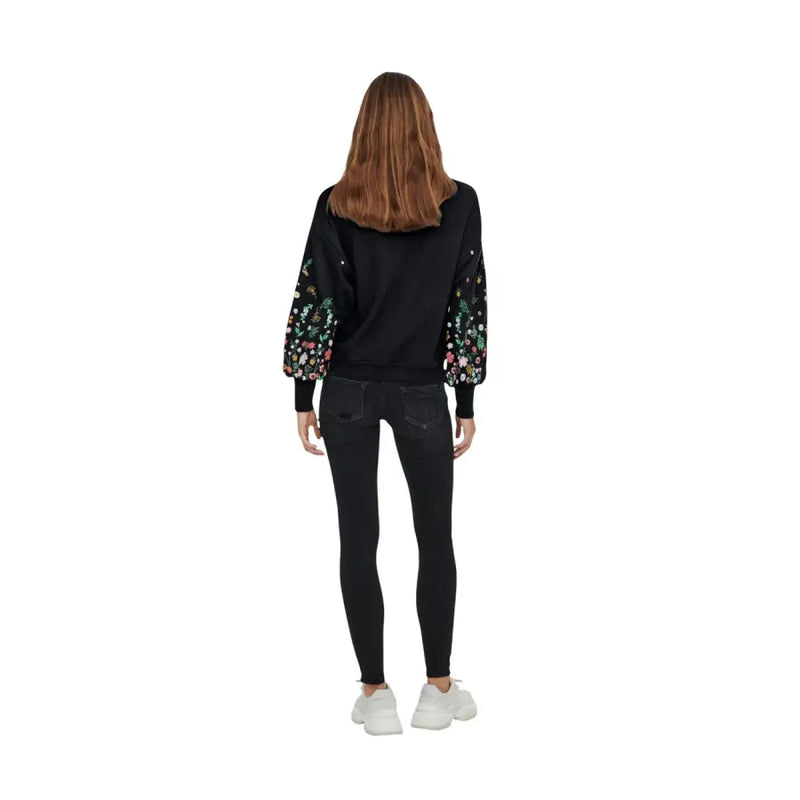 Black floral round neck sweatshirt for women featuring detailed floral embroidery on the sleeves