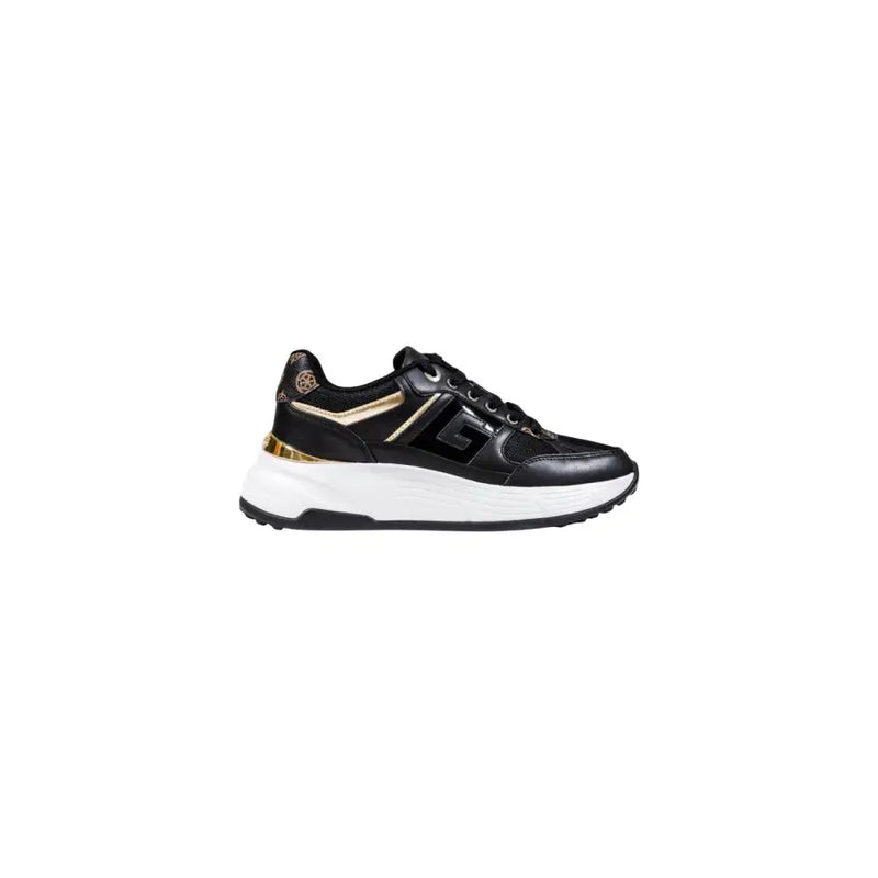 Black and gold women’s athletic sneaker with thick white sole from Guess Women Platform Sneakers collection