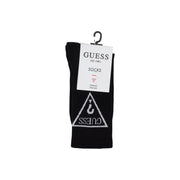 Black Guess sock in black featuring a white triangular logo with brand name and hook symbol displayed on a hanger