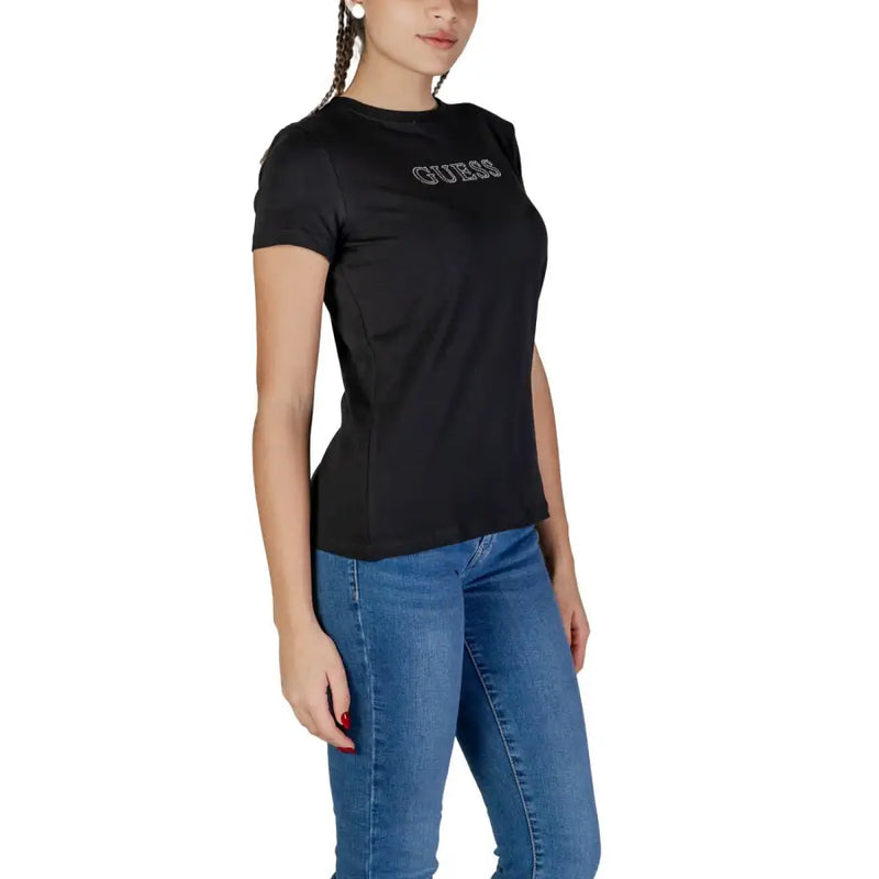 Black Guess T-shirt paired with blue jeans from Guess Active Women Spring Summer collection