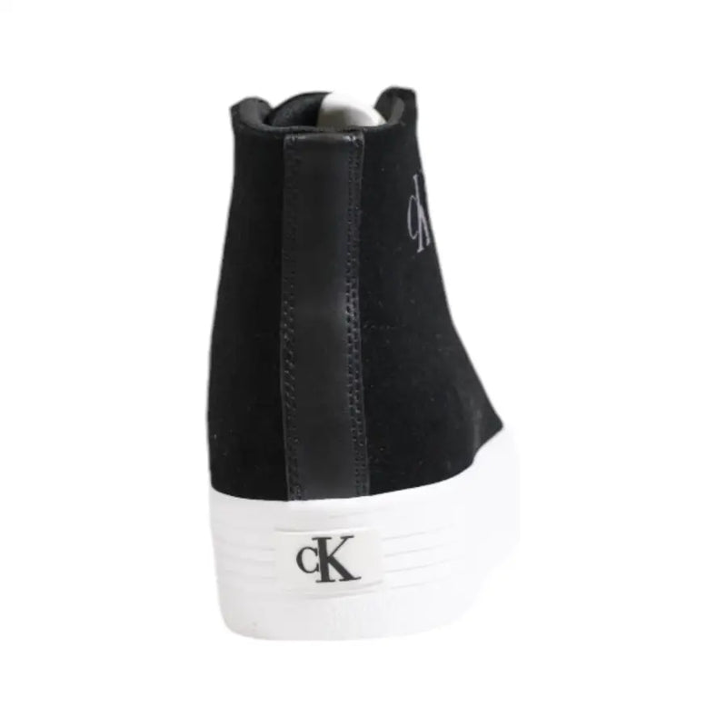 Black high top sneaker with white platform sole made of black suede featuring the ck logo embroidered on the side