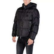 Black hooded puffer jacket with quilted design, silver zippers, and insulated material for cold weather use