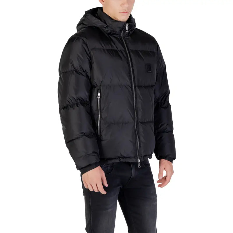 Black hooded puffer jacket with quilted design and small black logo patch on the chest