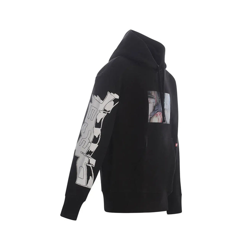 Black hooded sweatshirt featuring bold white graffiti print on left sleeve and rectangular chest graphic print