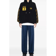 Black hoodie with yellow accents displayed, stylish and comfortable clothing option