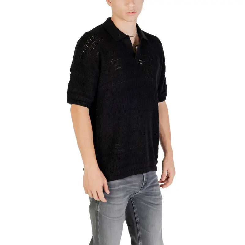 Black knit polo shirt with textured openwork pattern and short sleeves made from knitted fabric