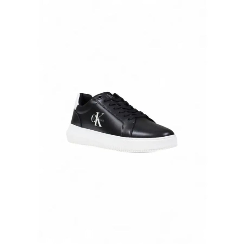 Black leather Calvin Klein sneaker with white sole displayed in product image