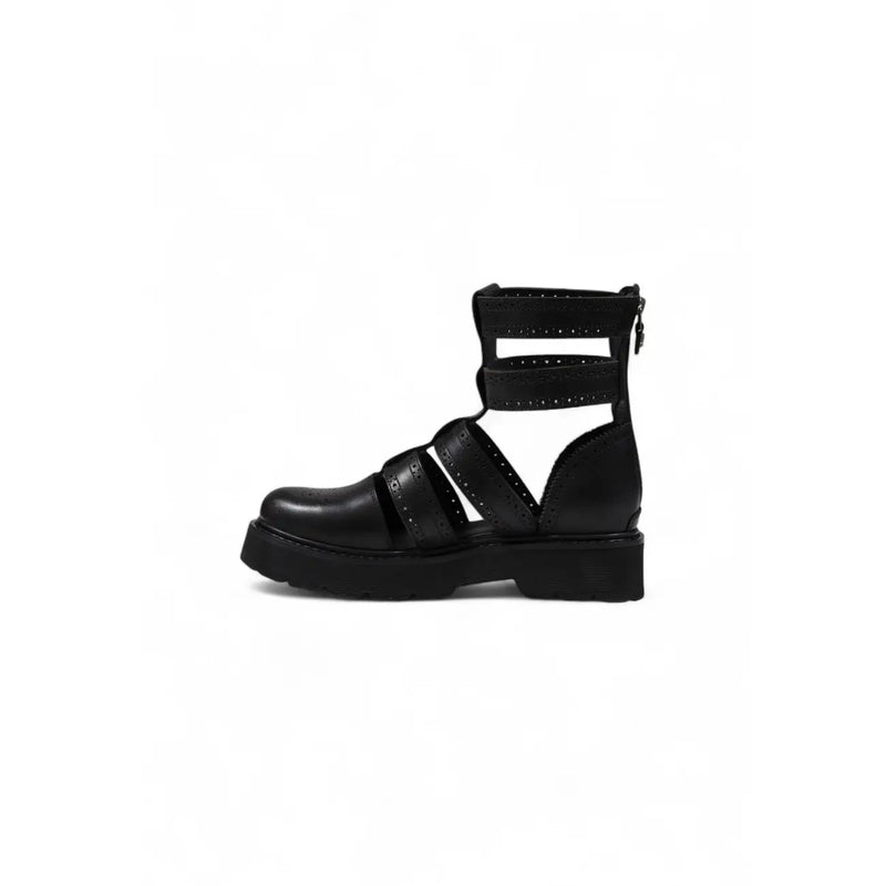 Black leather gladiator style ankle boot with crisscross straps and a chunky platform sole
