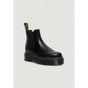 Black leather platform Chelsea boot with chunky sole and yellow stitching for stylish casual wear