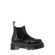Black leather platform chelsea boot showing the back side with smooth polished finish and sturdy sole