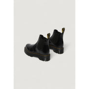 Black leather platform Chelsea boot in patent leather with yellow stitching and chunky rubber sole