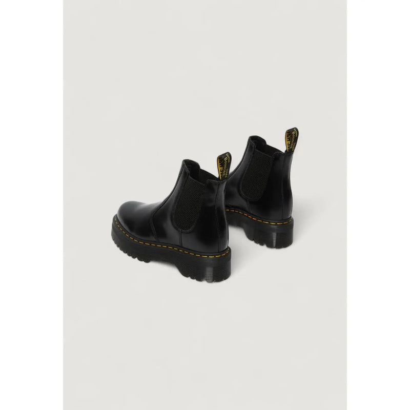 Black leather platform Chelsea boot in patent leather with yellow stitching and chunky rubber sole