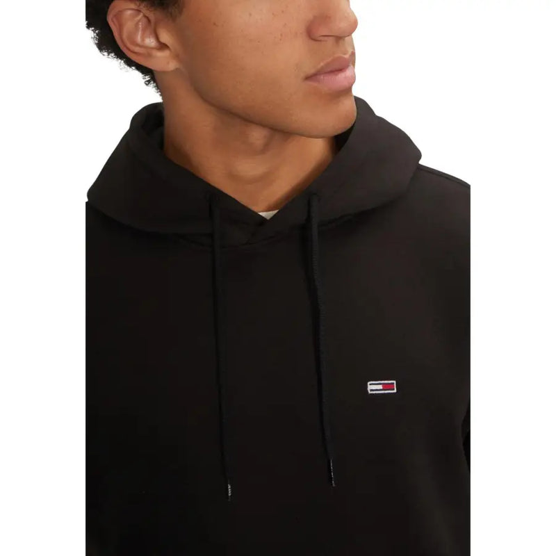 Black cotton hoodie with drawstrings and small embroidered Tommy Hilfiger logo on chest