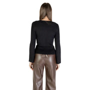 Black long round neck women knit sweater with rhinestones paired with brown faux leather pants