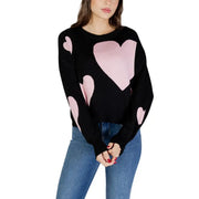 Black long sleeve round neck viscose knit top for women featuring pink heart patterns on a black sweater