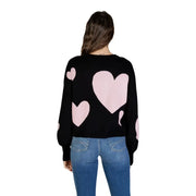 Black long sleeve round neck viscose knit top for women featuring pink heart patterns on a black knit sweater