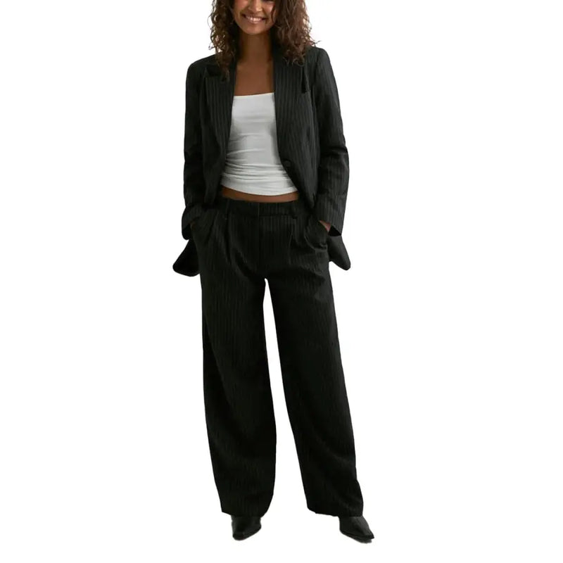 Black pinstripe blazer with lapel collar and pockets paired with matching wide-leg trousers set