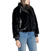 Black polyester blazer for women featuring gold-tone zippers, pockets, high collar, and faux fur bomber jacket style