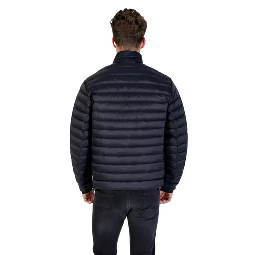 Men’s Black Quilted Puffer Jacket displayed in a stylish outdoor setting