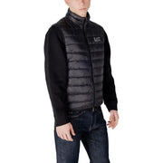 Black quilted puffer vest with high collar front zipper and ea7 logo on chest for warmth and style
