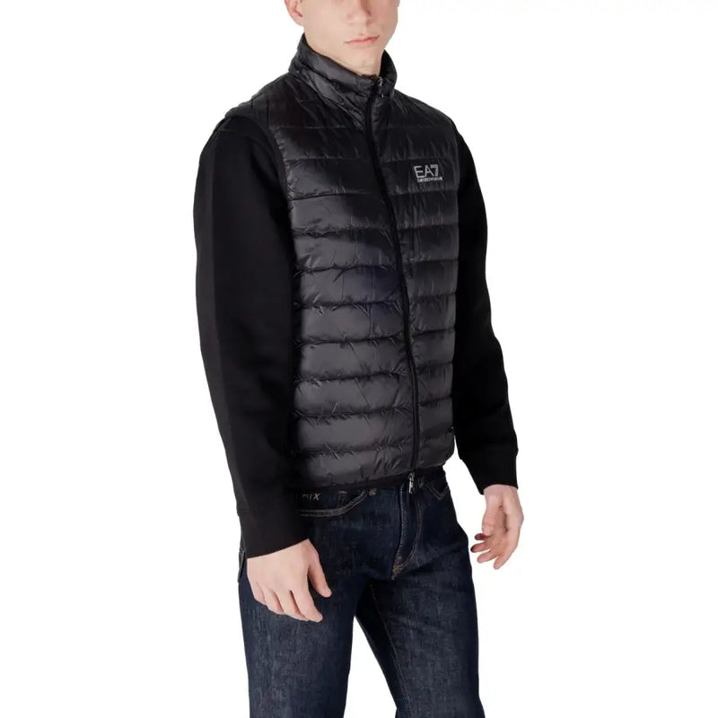 Black quilted puffer vest with high collar front zipper and ea7 logo on chest for warmth and style