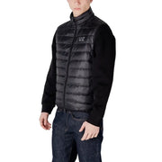 Black quilted vest with knit sleeves displayed in the Black Quilted Vest with Knit Sleeves product