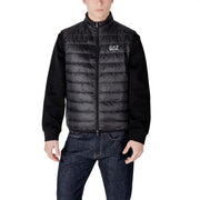 Black quilted puffer vest with knit sleeves zipper front and ea7 logo on the chest