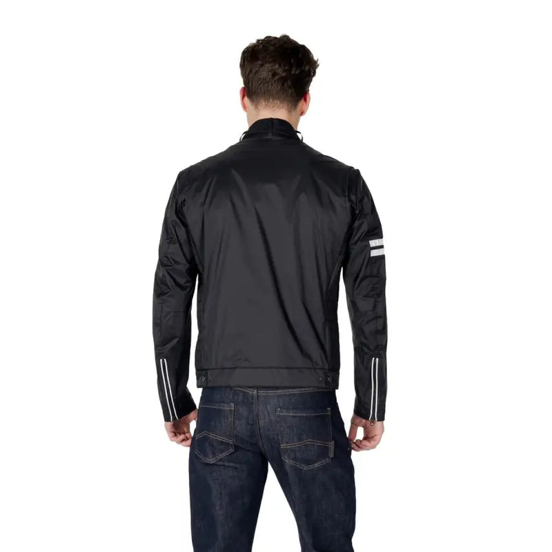 Black racing style jacket showing the back with reflective white stripes on sleeves and shoulders for enhanced visibility