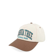 Cream-colored baseball cap with brown brim embroidered with yosemite national park in teal from black and red chevrolet racing cap