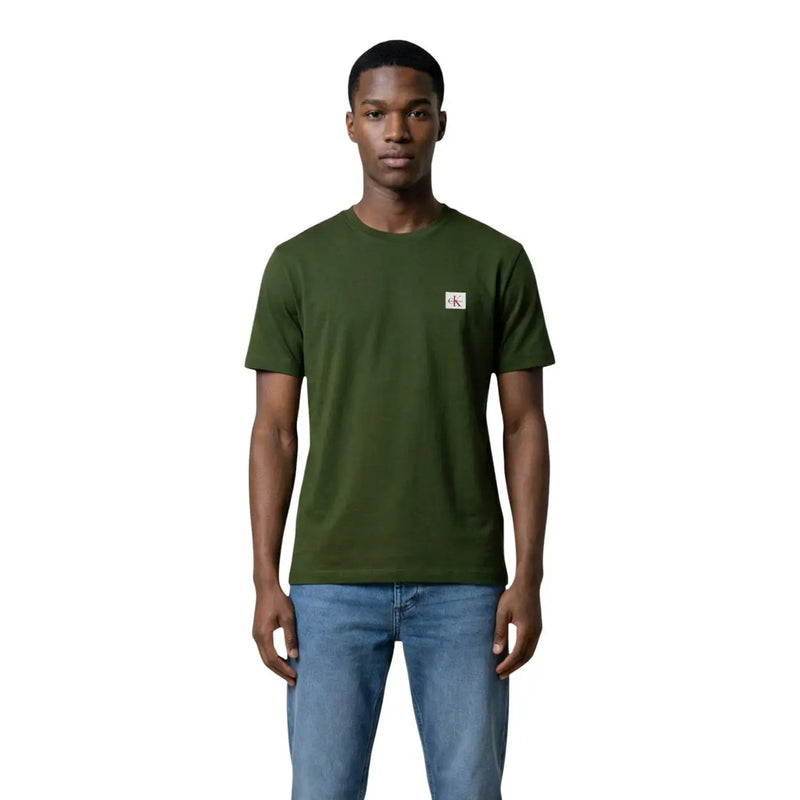 Black short sleeve crewneck t-shirt in olive green cotton with a small white Calvin Klein logo patch on the left chest